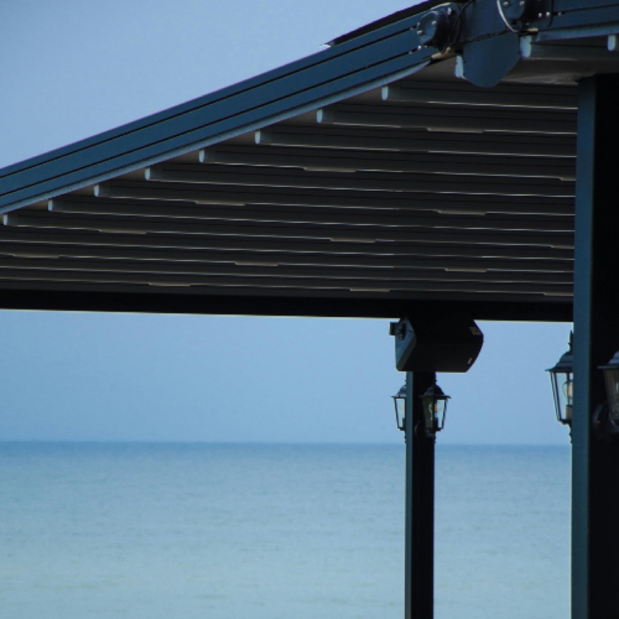 Aluminium louvre pergola roof with adjustable blades over an outdoor entertaining area